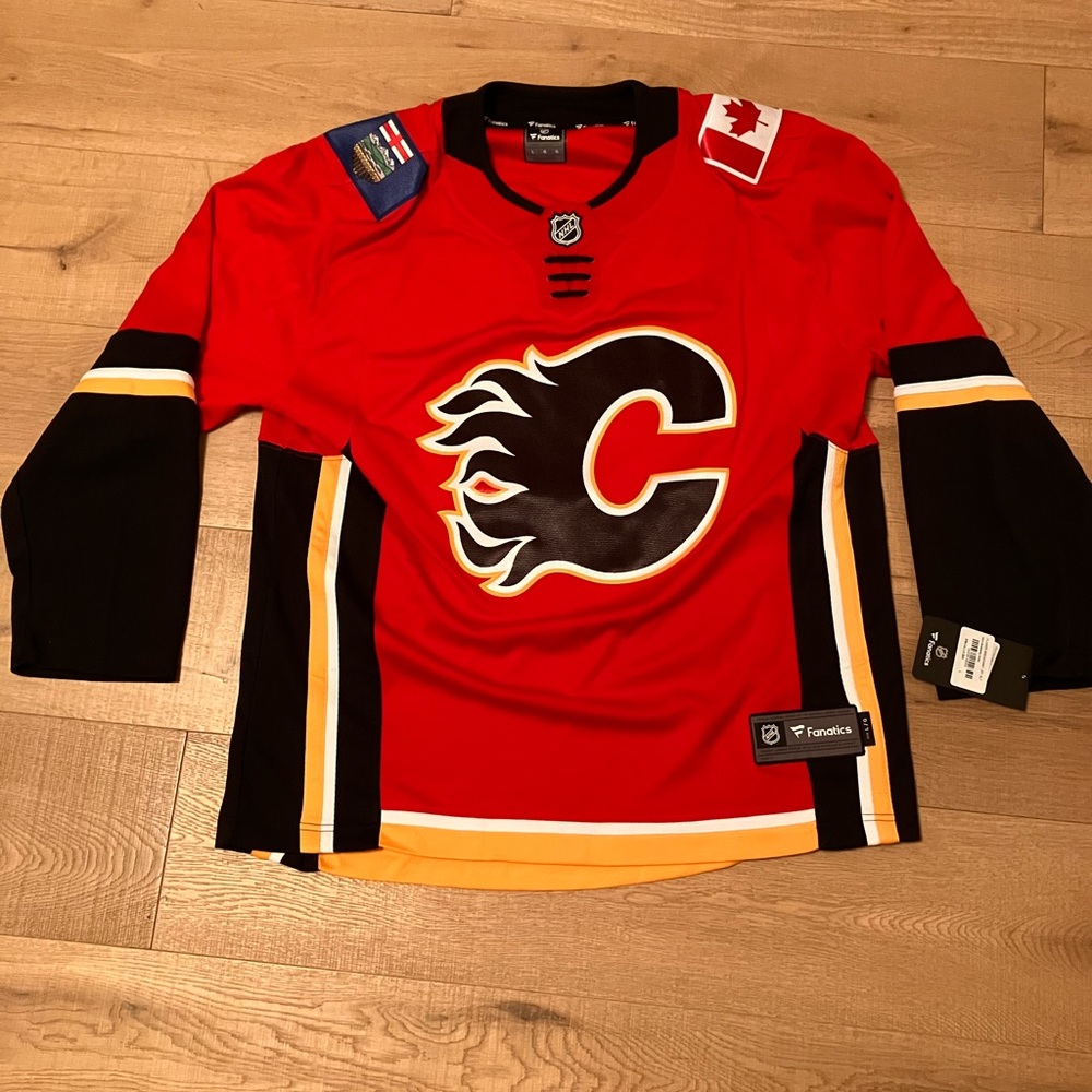 Calgary Flames NHL Alternate jersey red and black. Brand new with Tags.